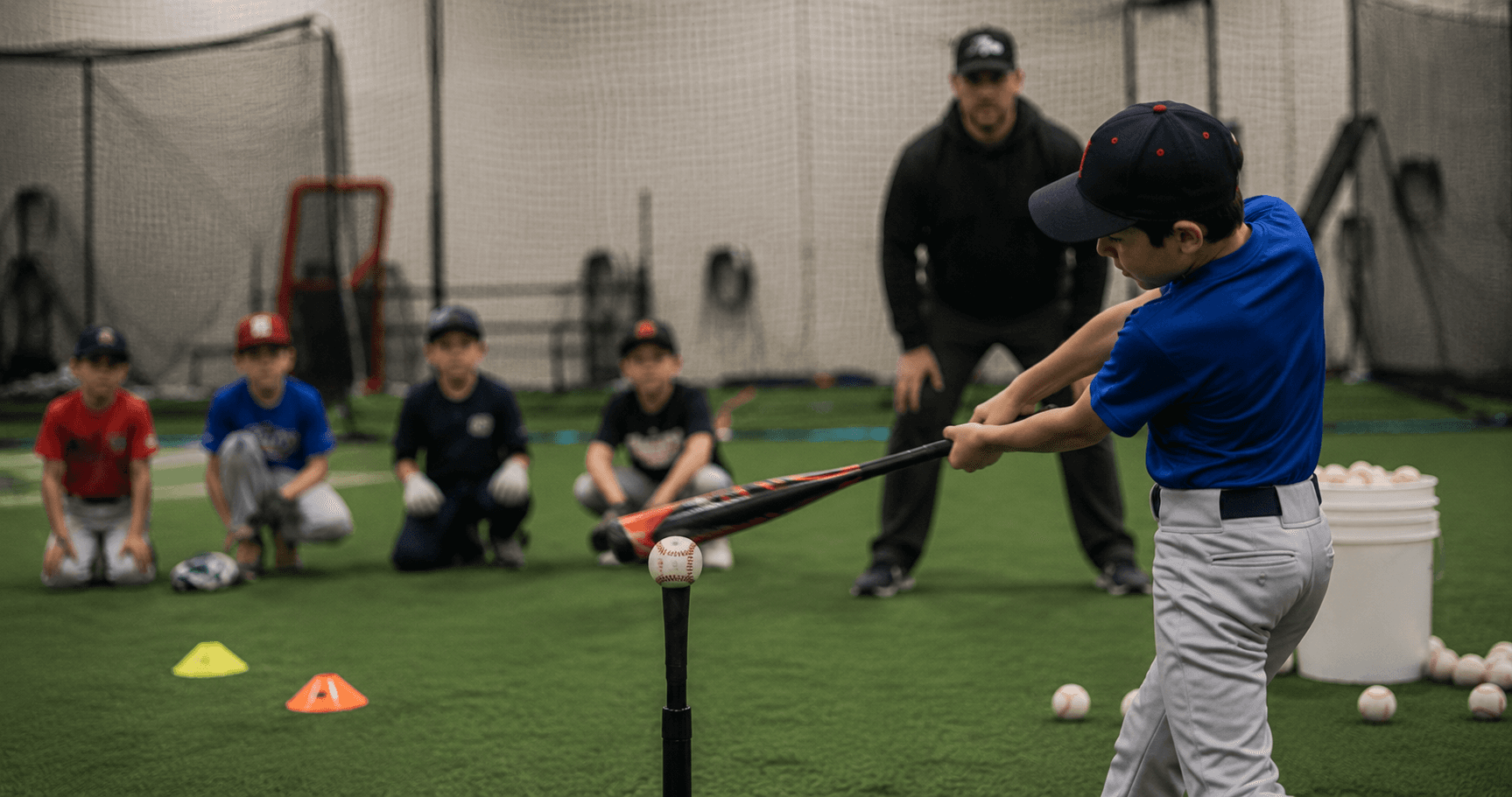 Youth baseball training at Lucky Athletic Club indoor facility